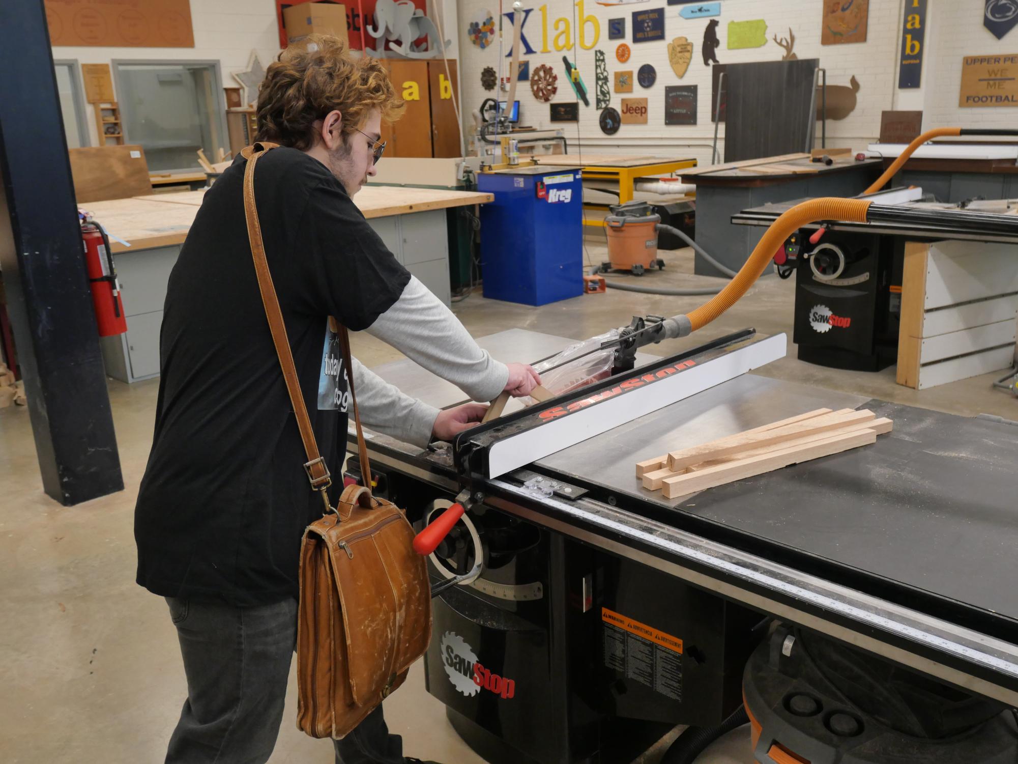 Student working on a table in the X-Lab.