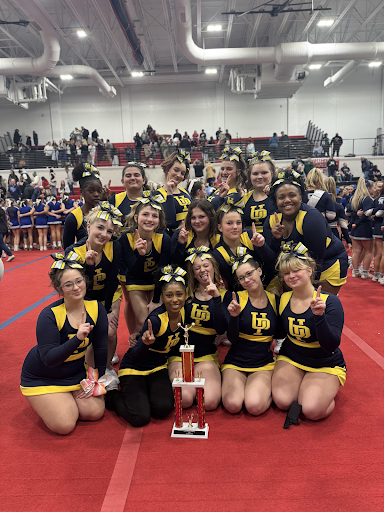 The cheerleading team poses with their trophy after placing first in their division at the Hatters Cheer Challange.
Pulled from @UPHSCheerleading on facebook.