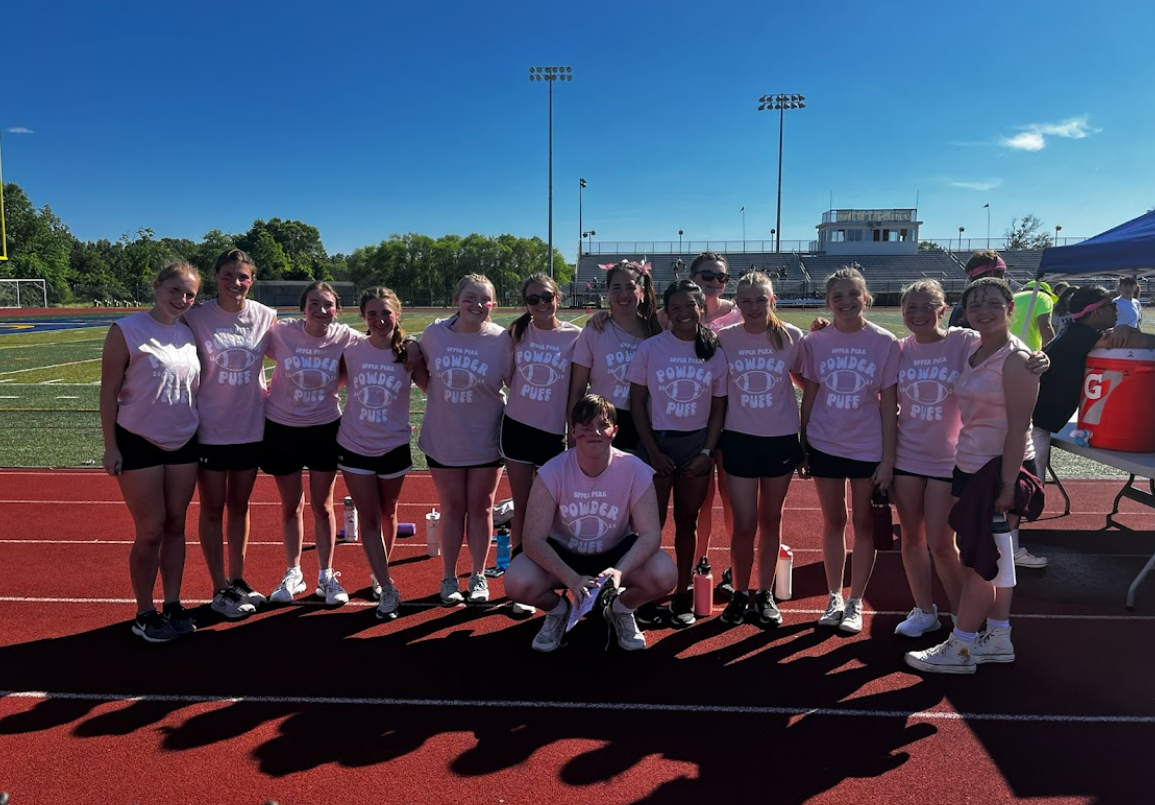 Powder Puff "The Bubbles" pose with their coach, Aaron Coates, at last year's tournament. Photo provided by Emily Foreman.