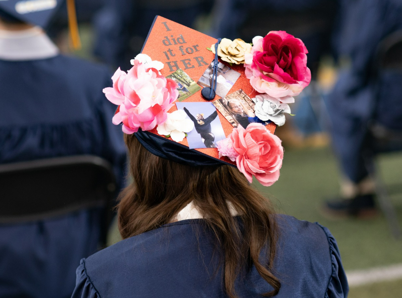 Class of 2022 graduate with decorated cap. Taken by Ryan Graf.